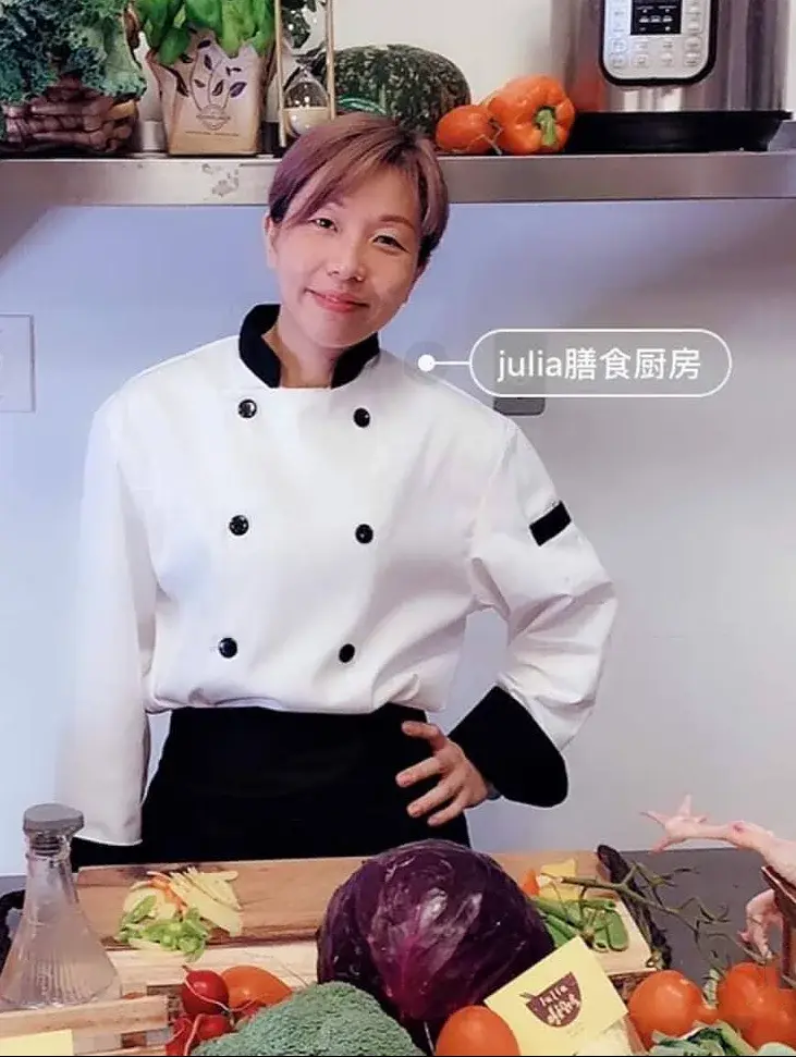 Julia, certified Greater Vancouver postpartum doula, in chef whites preparing Cantonese confinement meals